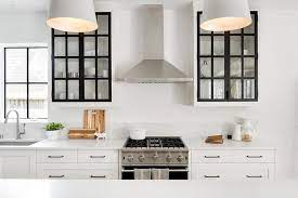 White kitchen cabinets with glass doors and black grid windows. White Cabinets With Black Frame Glass Doors Transitional Kitchen