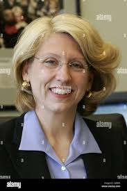 Michigan Secretary of State Terri Lynn Land is silhouetted against a window  as she speaks to a reporter following a news conference Wednesday, Nov. 8,  2006, in Lansing, Mich. Land announced that