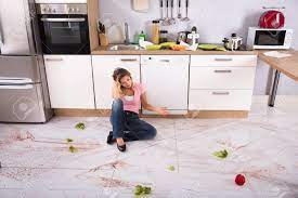 Download the perfect dirty kitchen pictures. Unhappy Young Woman Sitting On Dirty Kitchen Floor At Home Stock Photo Picture And Royalty Free Image Image 93987031