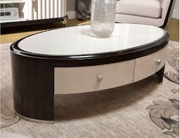 A modern fusion of wood and metal. Oval Cocktail Table Paris Chic Collection By Michael Amini