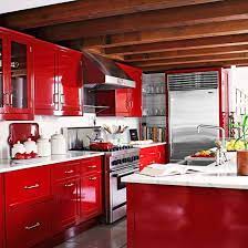 Seating at the breakfast bar. Warm Color Schemes Using Red Yellow And Orange Hues Red Kitchen Cabinets Interior Design Kitchen Red And White Kitchen