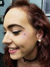 This Beauty Is So Happy To Have Her New Facial Piercing Cheek Dermal Also Known As A Teardrop She Chose A Dermal Piercing Facial Dermal Piercing Cz Ear Cuff