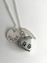 Pet cremation urns for cats and personalized pet urns for dogs give families a way to hold onto the ashes of their pet after they pass away. Personalized Pet Memorial Necklace Paw Print Urn Pet Ashes Jewelry Cat Ashes Necklace Personalized Hand Stamped Jewelry Pet Ashes Jewelry Hand Stamped Jewelry