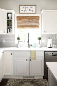 I did find one picture of a bamboo backsplash, but it wasn't made with poles. Modern Farmhouse Kitchen With Grey Subway Tile Backsplash White Cabinets And Bamboo Kitchen Window Coverings Kitchen Remodel Layout Kitchen Backsplash Designs