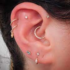 ear curation on instagram double upper helix flat forward helix daith and triple lobe piercings earings piercings pretty ear piercings cute ear piercings