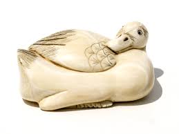 To be a netsuke, the carving must have one or two holes (himotoshi) to allow attachment to the sagemono. Unknown Artist Ivory Duck Netsuke Scrimshaw Collector