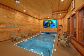 Check out all of our pigeon forge cabins with a private indoor pool today to plan your vacation to the great smoky mountains! Gatlinburg Cabin Rentals In The Smoky Mountains Indoor Pool House Small Indoor Pool Pool Bedroom