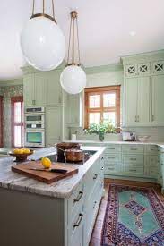 It gave a little bit excitement into these pale colors! Mint And Copper Kitchen Inspiration Image Source Hgtv Photo Credit Erin Williamson Green Kitchen Designs Traditional Kitchen Design Cottage Style Kitchen