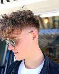 And by curly we mean both curly and wavy men's hair, as the two styles have plenty in common. 7 Wearable Curly Faux Hawk Styles For Men