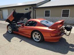 Speed kings hennessey venom 1000 twin turbo viper 2005 hennessey srt 10 viper venom 1000 review supercars net hennessey venom 1000 twin turbo dodge viper srt10 snake skin green hennessey venom 1000tt up for sale autoblog John Hennessey S Twin Turbo Viper Venom 800 Is For Sale The Drive
