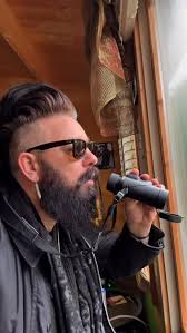 In reality Redshank don't mind the wet weather. As soon as the rain eased  this one shook itself off and continued foraging for small shellfish,  crustaceans and invertebrates in the shallow pool.