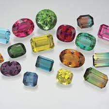 A True Rainbow Stone Tourmaline Comes In Many Tantalising Colours With Some Displaying Two Or Thr Tourmaline Gemstone Stones And Crystals October Birth Stone