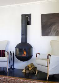 Not only can you adjust the flame color, the ember bed and sidelights also glow with different colored lights. 8 Stunning Suspended Fireplaces In Every Shape
