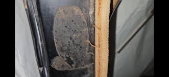 New Oklahoma Signs (Subsidiary of Standard Oil Company of New Jersey)  getting new plastic signs ready after buying Gaseteria.