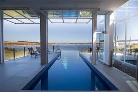 20 Stunning Indoor Infinity Pool Designs Indoor Outdoor Pool Indoor Pool Pool Houses