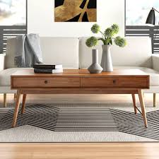 Round tables are a small space savior, and this side table could easily be repurposed as a coffee table for a super narrow space. Mid Century Modern Style Coffee Tables You Ll Love Home