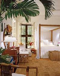 Tropical Island Beach Home Decor Tropical Bedroom With Palm Tree Canopy Bed And Jute Flooring British Colonial Decor Tropical Home Decor Tropical Bedrooms