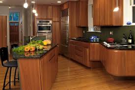 Maybe you would like to learn more about one of these? Modern Kitchen With Walnut Cabinets Black Marble Countertops Hgtv
