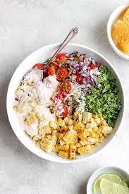 Scoop the cotija cheese generously on the corn, making sure it covers all sides. Mexican Street Corn Salad Fit Foodie Finds