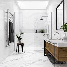 Bathroom flooring can make a big statement, whether it's a large master bathroom or a small powder room. Wall And Floor Tiles In Polar White Marble Effect Matt 300 X 600 Mm White Marble Bathrooms White Marble Tile Bathroom Bathroom Interior Design