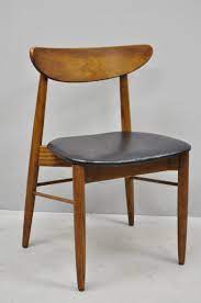 The late fifties armchair with the classic wooden armrests. 4 Vintage Mid Century Modern Danish Style Curved Back Walnut And Oak Dining Chairs At 1stdibs