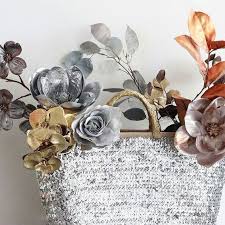 Get creative and mix white fake flowers with cream artificial flowers, add a dash of artificial greenery, and sprinkle in white roses or white hydrangeas for an everlasting and elegant look. Give Your Bridal Bouquets And Centerpieces Metallic Accents With Artificial Flowers In Gold Silver Rose Silk Flowers Wedding Artificial Flowers Faux Flowers