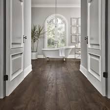| w ginger spiced pine waterproof laminate wood flooring 16.12. Pergo Portfolio Wetprotect Waterproof Rustic Smoked Chestnut 7 48 In W X 54 33 In L Waterproof Embossed Wood Plank Laminate Flooring 19 76 Sq Ft Lowes Com House Flooring Rustic Flooring Wood Laminate Flooring