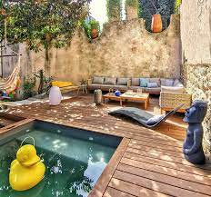 As a general rule, the average price of a standard fiberglass pool package is the length of the pool, times $1,000 dollars, plus $10,000 dollars. A Raised Lounge Area With A Small Pool Was Designed For This Backyard