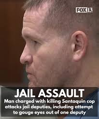 The man charged with killing a Santaquin police officer last year faces new  charges after he allegedly attacked deputies at the Utah County Jail  yesterday, including trying to gouge the eyes out