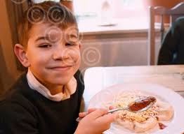 39359571-Ethan, six, from Fakenham Infant and Nursery School enjoying his  pizza at the Crown. Picture: DENISE BRADLEY