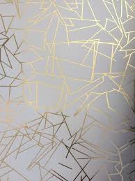 Gold accents tie everything together! White Wallpaper With Gold Accents