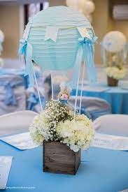 40 Diy Baby Shower Centerpieces That Are Cheap To Make Cafemom Diy Baby Shower Centerpieces Balloon Baby Shower Centerpieces Baby Shower Balloons