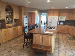 Commercial kitchen w/ stainless appliances, maple cabinets, granite counters & hardwood floors throughout main & upper levels. How Do I Remodel Kitchen And Keep Maple Cabinets