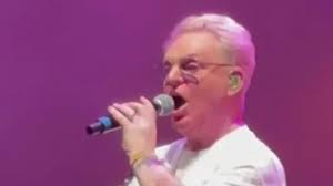Festival forced to APOLOGISE for Erasure singer Andy Bell's 'below par'  performance in which he sang out of tune and lost his mic sparking mass  walkout from annoyed fans