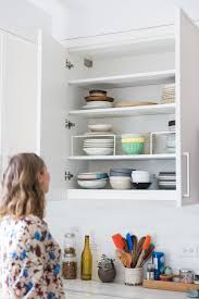 If you are going to incorporate a plate rack into other regular wall cabinets, think about making them glass so that the whole wall has a sense of openness and depth. How To Organize Your Kitchen Cabinets And Pantry Feed Me Phoebe