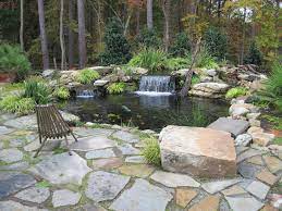 Dry Set Crab Orchard Flagstone Patio Tennessee Boulder Wall And Water Feature By Edge Landscapes Flagstone Patio Ponds Backyard Flagstone