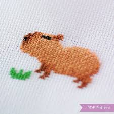 The minimalistic cross stitch designs only include the boarder of the country map. Zbrl Kgztcqkkm