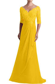 Captivating long sleeve evening gown with sheer sleeves and back. Golden