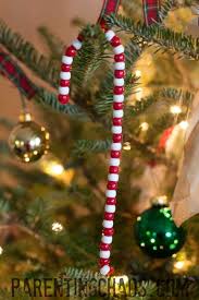 I used two sections of red and white clay, and one section of green clay. Beaded Candy Cane Ornament