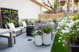 Plant shrubs and small trees among the flowers to add height, structure, and visual interest to garden beds. Small Space Gardening Ideas Hgtv