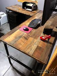 The plastic table top worktop rests on nifty file drawers that you can find online or at a local office supply store. Diy Laminate Flooring Table Top Desk Simplified Building