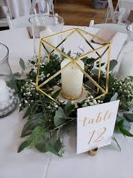 Round Tables With Hold Centerpiece Greenery And Table Numbers Wedding Weddings Wedding Centerpieces Diy Greenery Wedding Centerpieces Round Wedding Tables