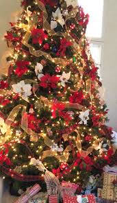 Christmas Tree Decor Decorated With Red And White Poinsettias And Gold A White Christmas Tree Decorations Christmas Decorations Tree Ribbon On Christmas Tree