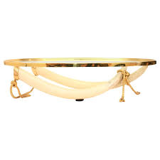 Price coffee table with base featuring two faux ivory tusks. Elephant Tusk Coffee Table 8 For Sale On 1stdibs