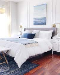 Blue And White Calming Bedroom With Coastal Style Decorating With Blue And White For Spring J White Wall Bedroom White Master Bedroom Master Bedrooms Decor