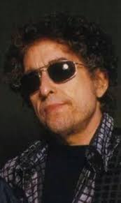 POST YOUR FAVORITE PHOTO OF DYLAN SMILING" and tell us why you think he  seldom smiles in pictures. My theory is something like Bobby's lyric: "“I  wear dark glasses to hide my