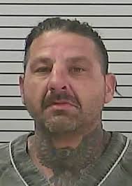 Man charged with setting structures