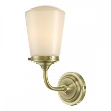 This model uses (1) 60 watt medium base incandescent bulb. Bathroom Wall Light Antique Brass Opal Glass