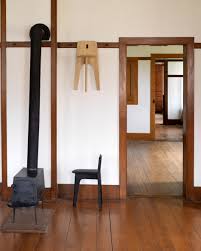 The original purpose of a chair rail was to guard the wall against damage the backs of errant chairs. Designers Reinterpret Shaker Artefacts For New York Exhibition