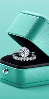 The Tiffany Setting And Tiffany Embrace Rings In Platinum Engagement Rings Wedding Bands Set Tiffany Engagement Tiffany Wedding Rings